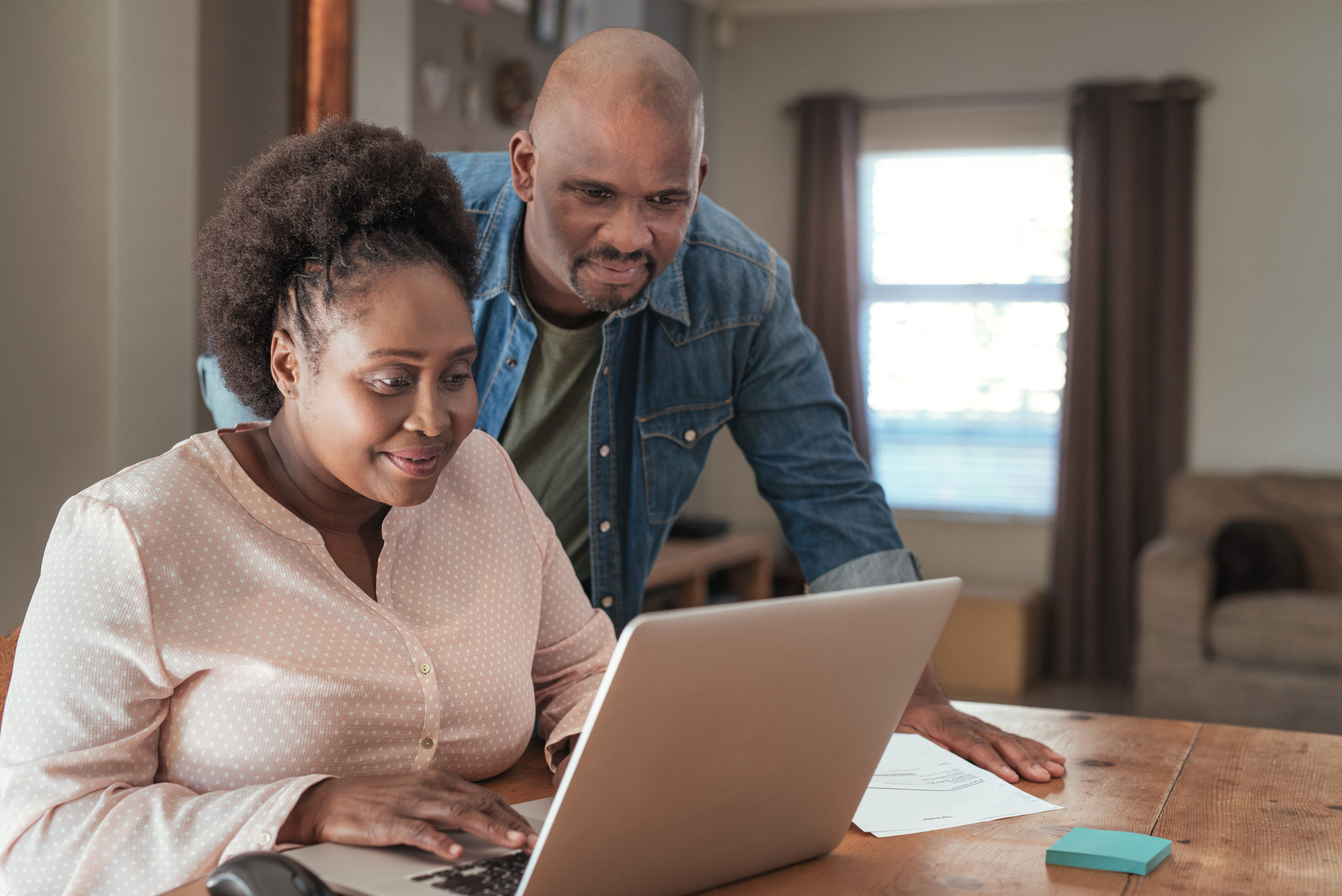 Smiling,African,Couple,Doing,Their,Online,Banking,And,Paying,Bills